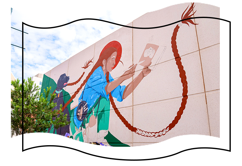 Mural on wall on the side of the street